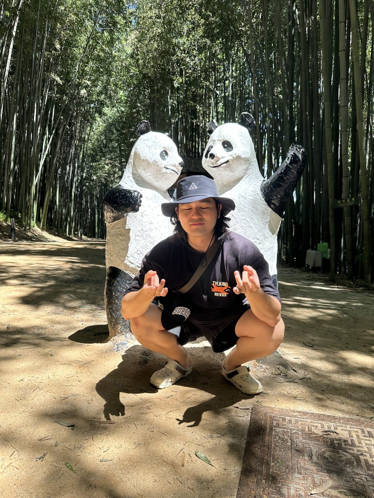 Panda statues in a bamboo forest